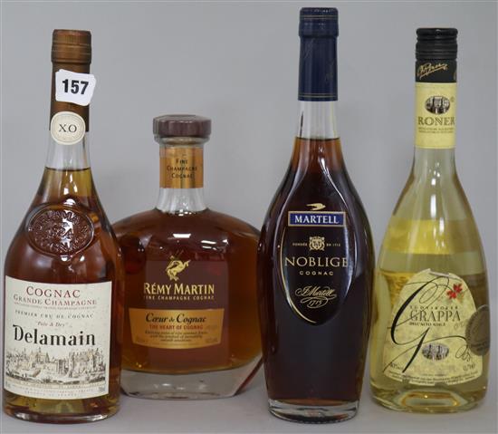 A bottle of Delamain XO Rare & Dry, two cognacs and one grappa